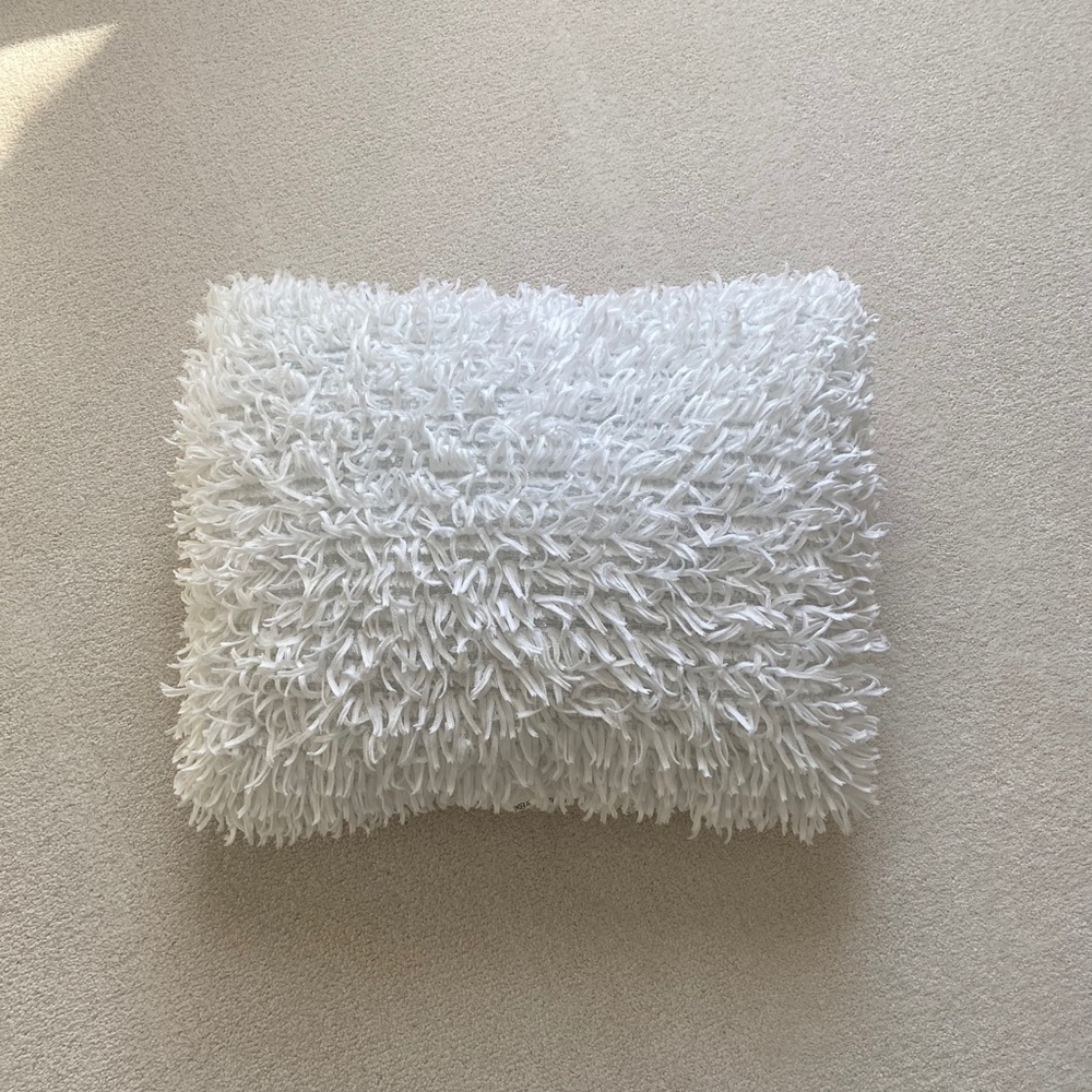 Fluffy white throw pillow